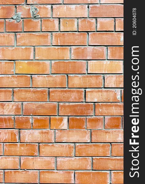 Old weathered stained red brick wall background