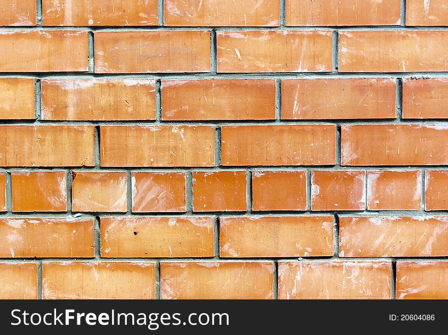 Old weathered stained red brick wall background