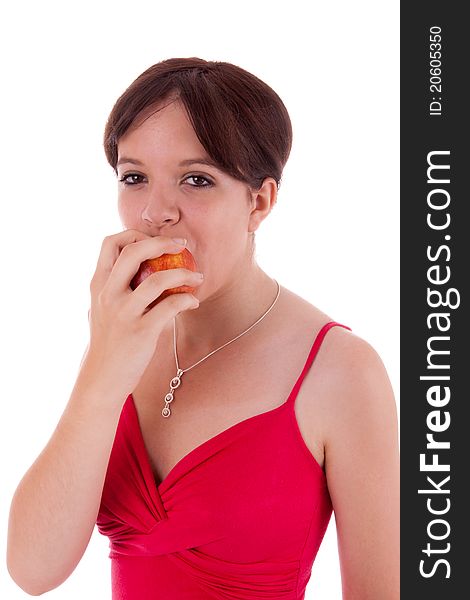 The pretty young woman biting into an apple. The pretty young woman biting into an apple