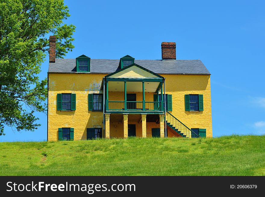 Yellow House on top of grassy hill at Fort Washington Maryland. Yellow House on top of grassy hill at Fort Washington Maryland