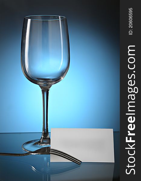 Clear card on a fork On a dark blue gradient a background