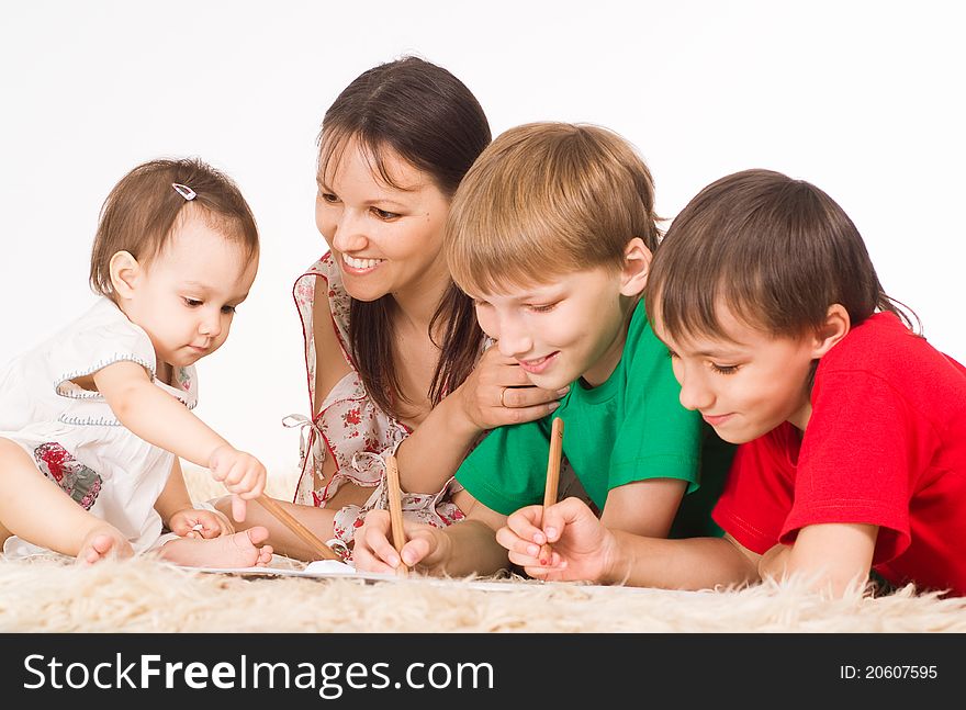 Mom and her children drawing on carpet. Mom and her children drawing on carpet