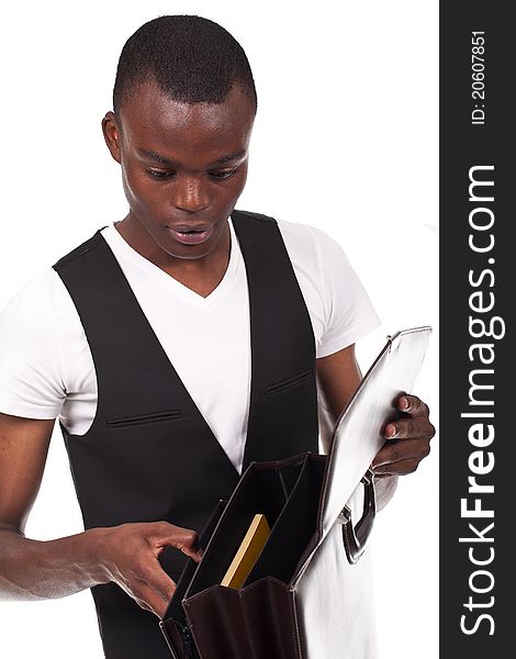 Young and beautiful black man holding a briefcase and papers
