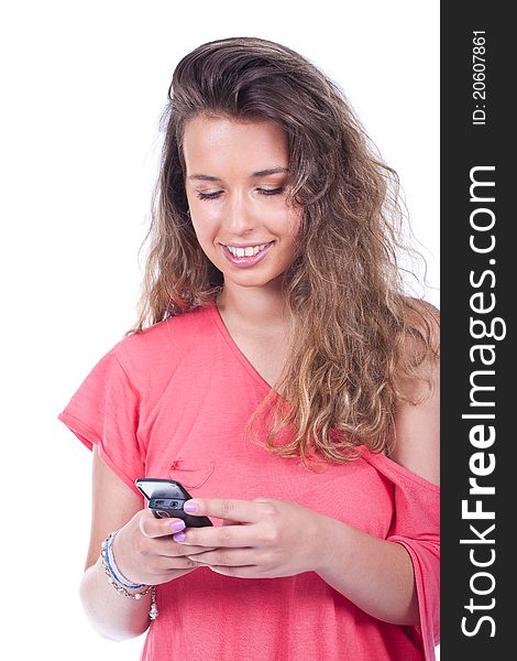 Young and beautiful woman holding and smiling at the cell phone. Young and beautiful woman holding and smiling at the cell phone