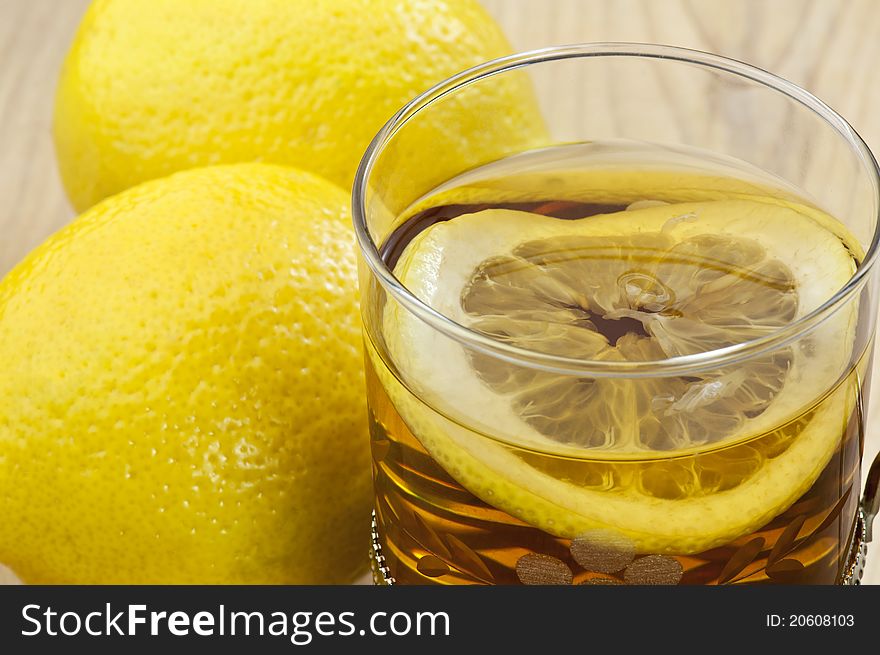 a cup of tea with a slice of lemon. a cup of tea with a slice of lemon