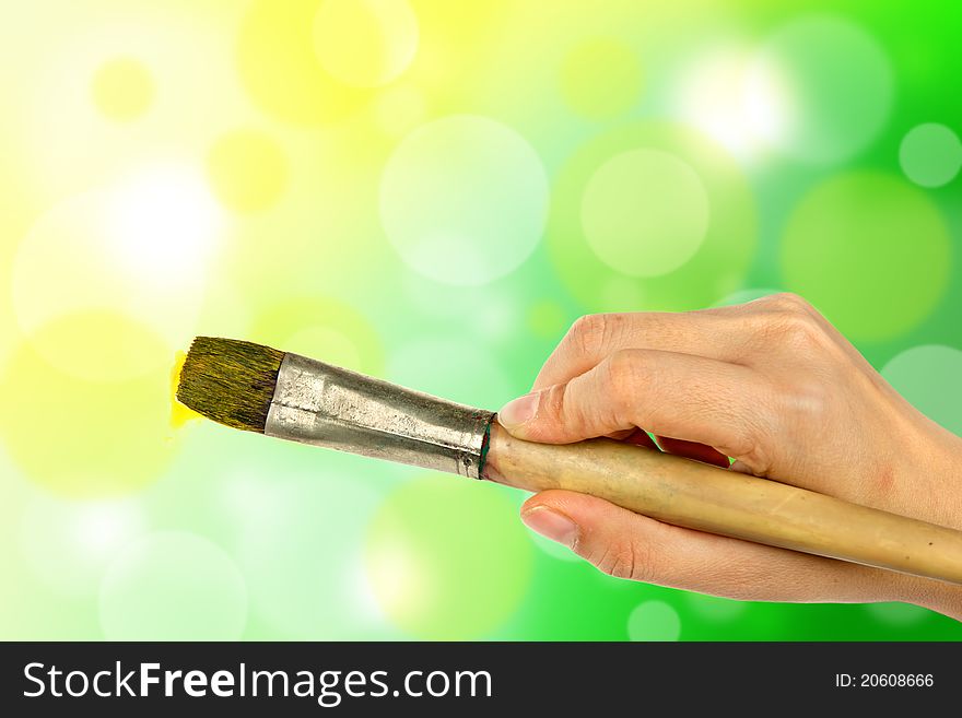 Woman hand painting color with paintbrush