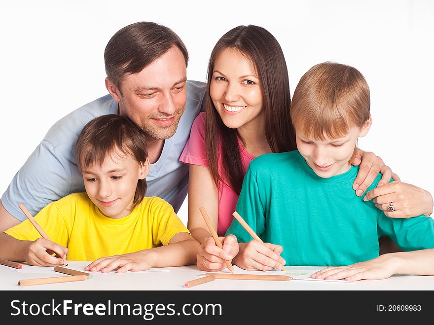 Nice family drawing at table on white