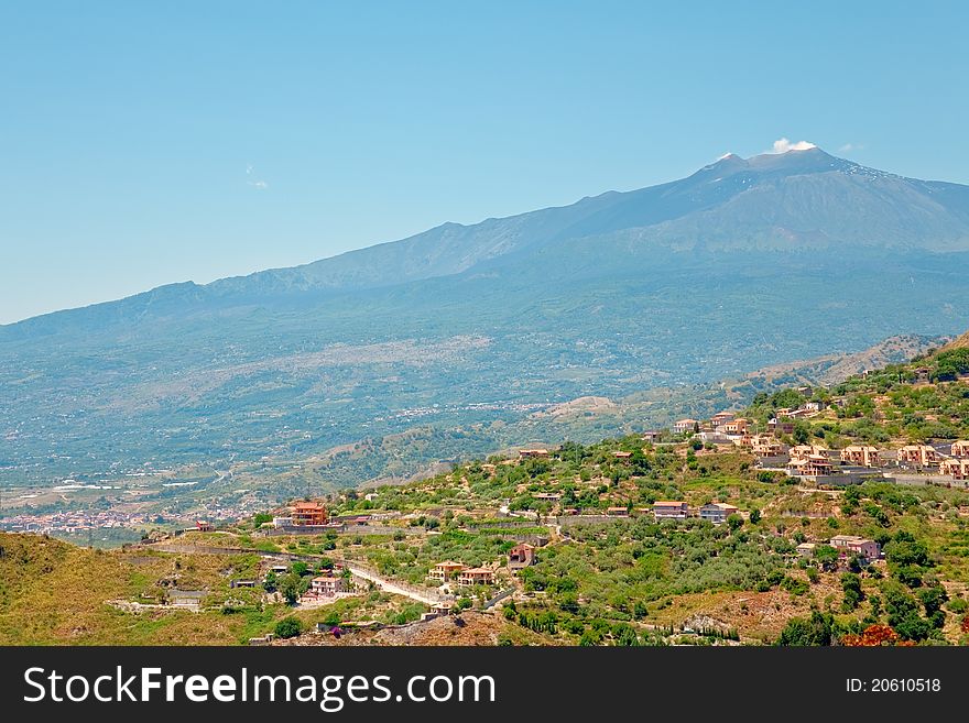 View on Etna and agricultural gardens on sicilian hills