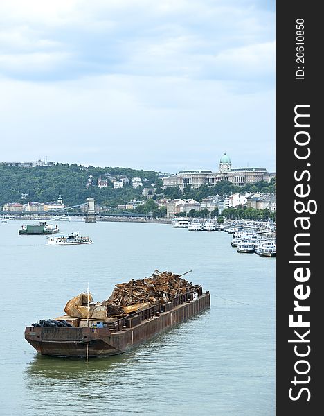 Boat with metal junk floating on water