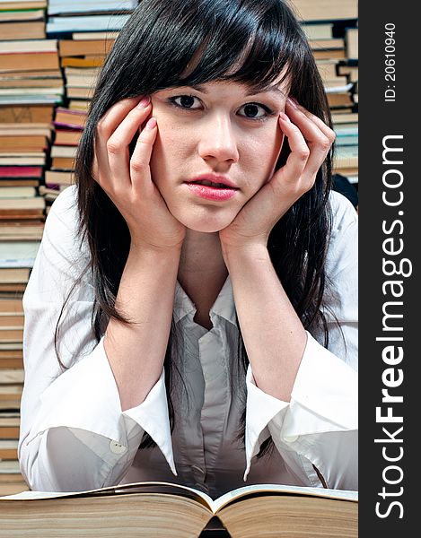 Young college girl with book opened