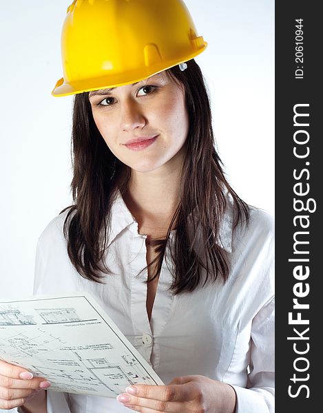 Beautiful business woman with construction plans