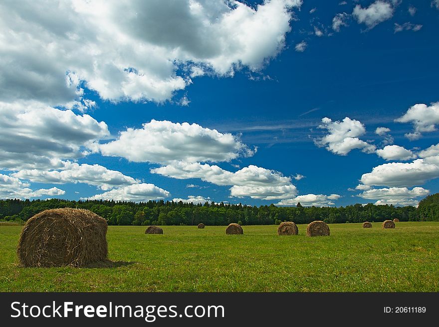 Green Field With Haystacks