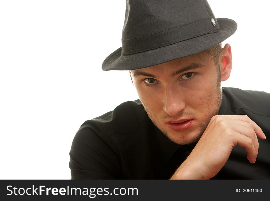 Handsome male model wearing a hat looking like a mobster. Handsome male model wearing a hat looking like a mobster