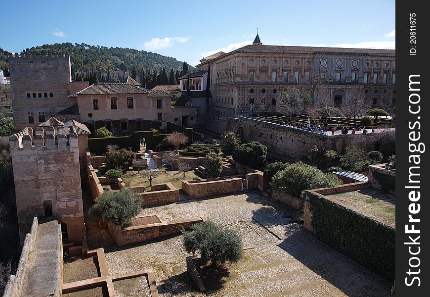 A view overlooking the old ruins of the Alhambra palace buildings on a nice sunny day.