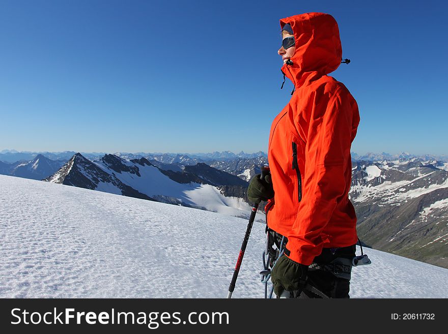 Young woman enjoying the view in high mountains. Young woman enjoying the view in high mountains