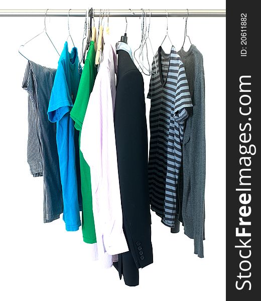 Garments hanging on coat hanger isolated against a white background. Garments hanging on coat hanger isolated against a white background