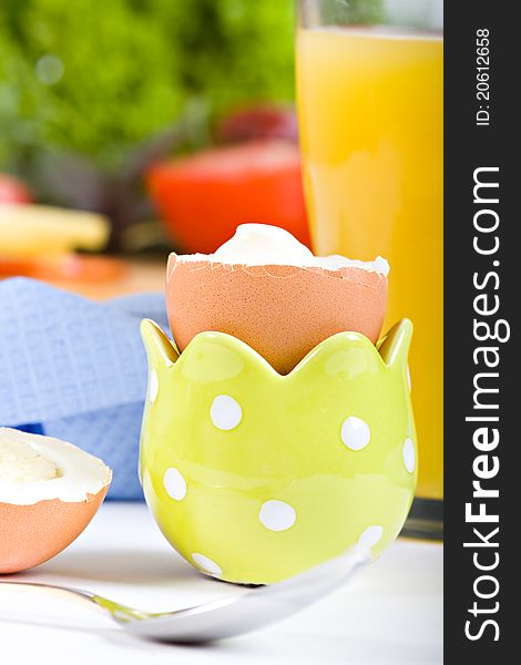 Delicious boiled egg in eggcup. Morning breakfast