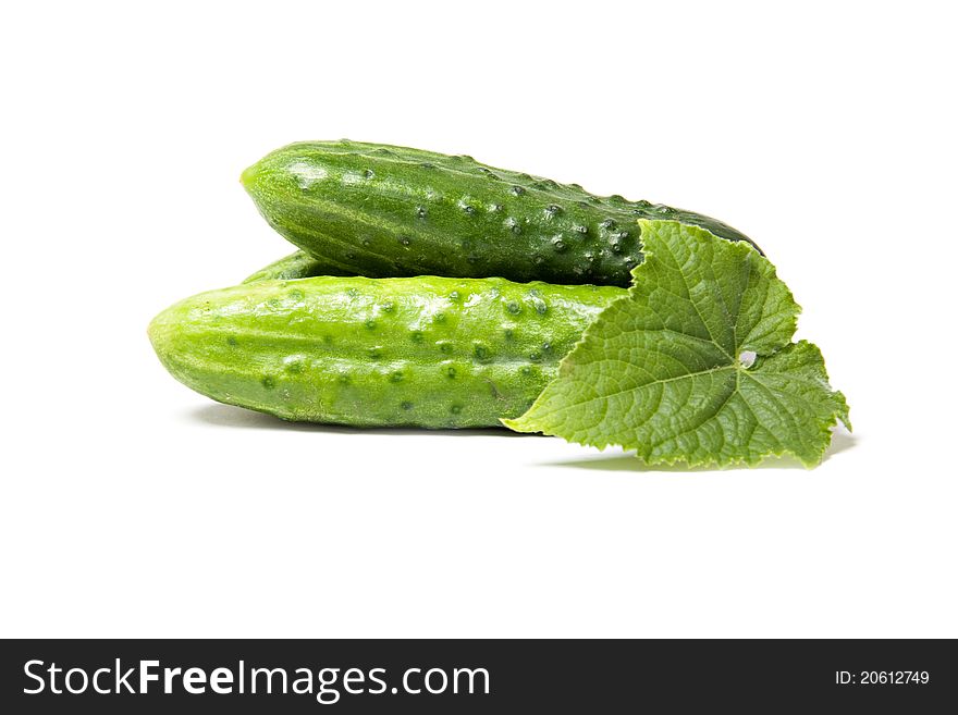 Fresh green cucumbers isolated over white