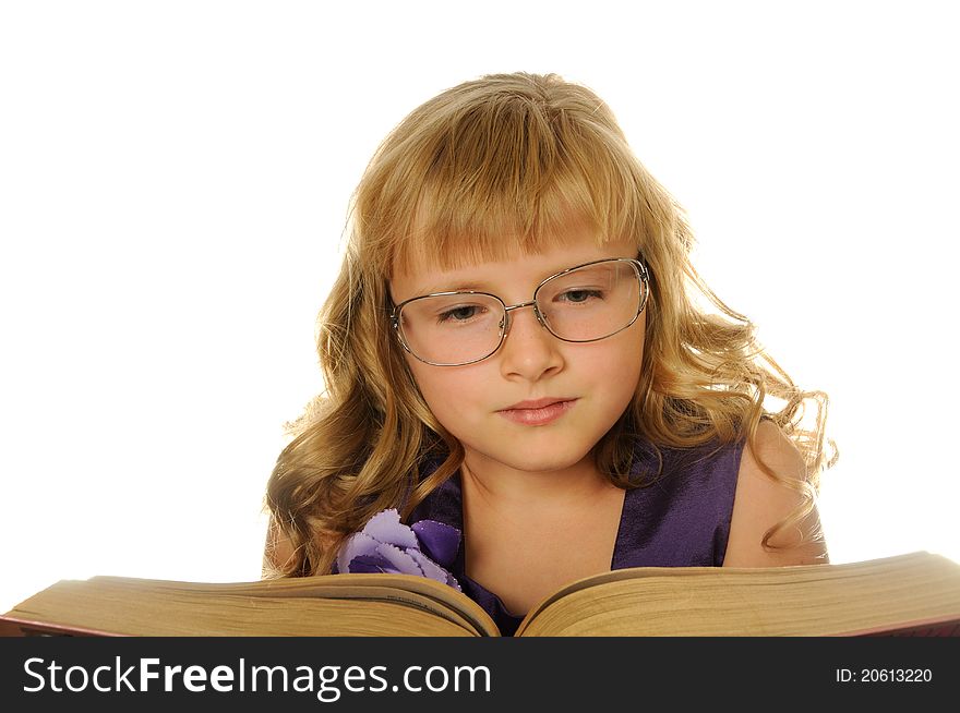 Girl with glasses reading big book, isolated on white. Girl with glasses reading big book, isolated on white