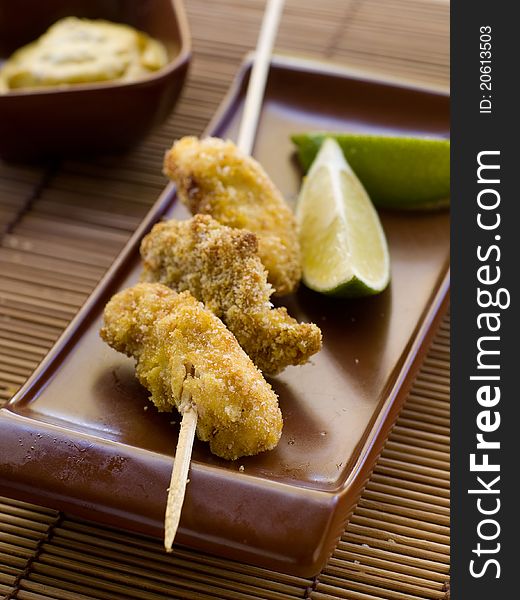 Fresh chicken nuggets with mustard sauce. Selective focus