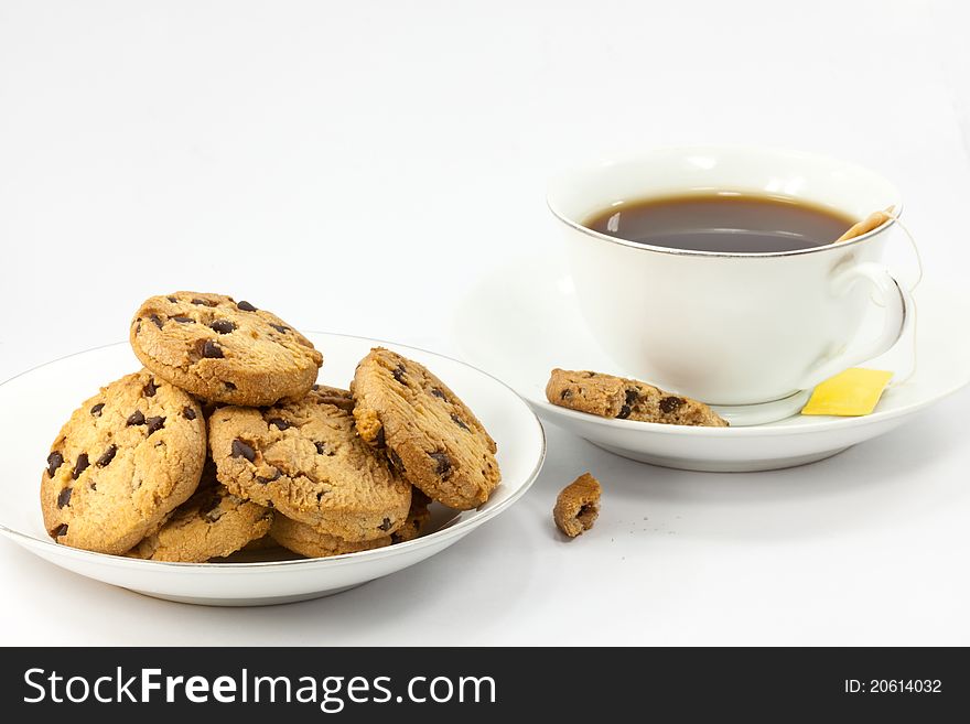 Cookies and a cup of tea on white background. Cookies and a cup of tea on white background