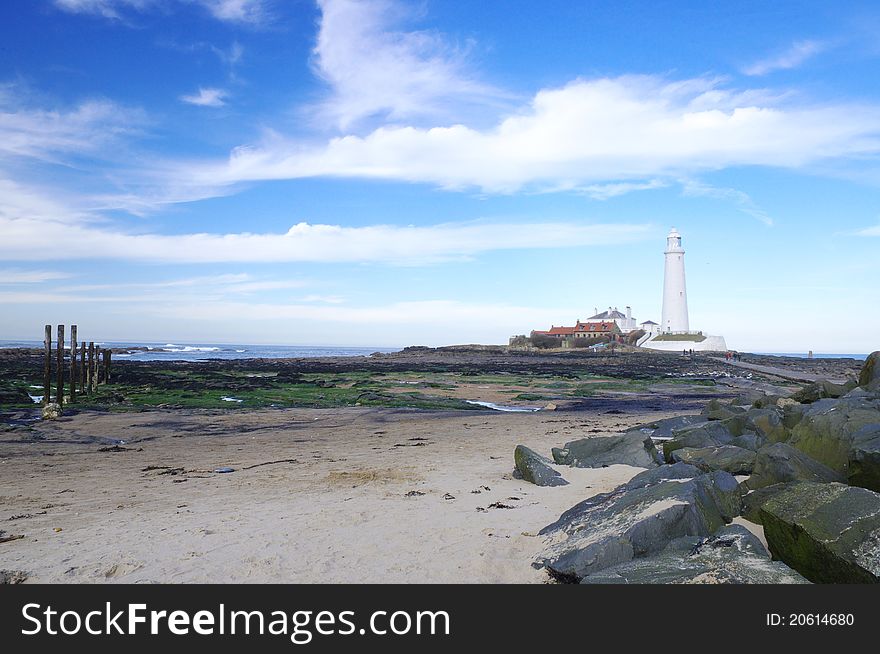 The lighthouse in perspective to the beach. The lighthouse in perspective to the beach