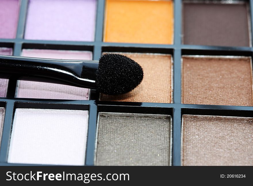Makeup brushes and make-up eye shadows. Makeup brushes and make-up eye shadows