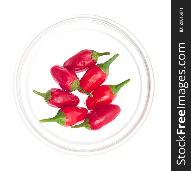 Red pepper portion in glass bowl on white