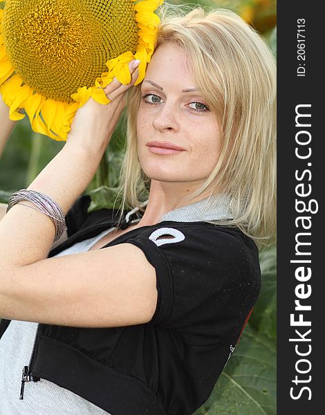 Beauty Woman And Sunflowers