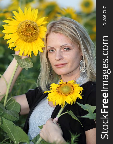 Beauty woman and sunflowers