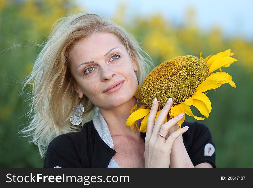 Beauty woman and sunflowers