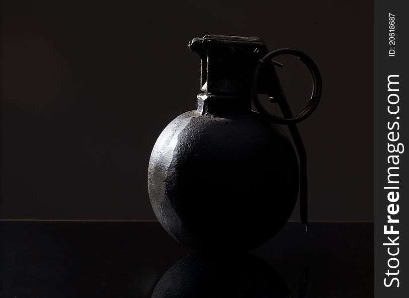 Hand grenade on dark background