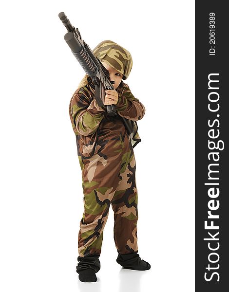 A cute little girl taking aim with a toy machine gun while playing soldier.  Isolated.