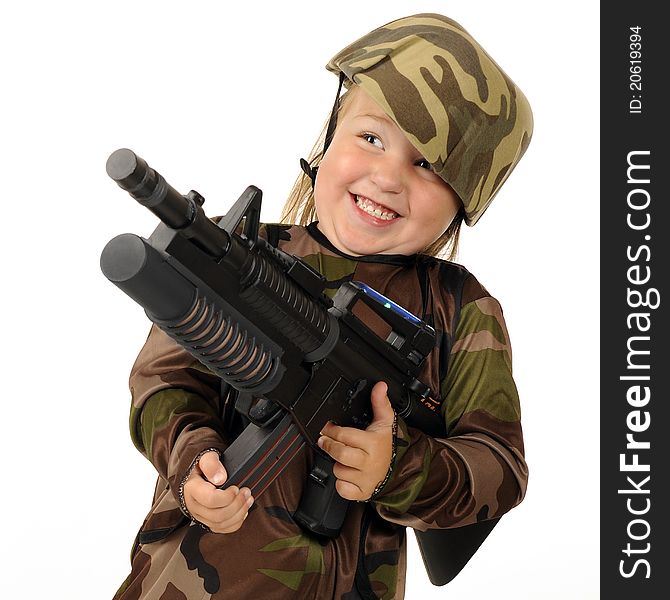 Closeup image of a tiny girl soldier delightedly firing a toy machine gun. Isolated. Closeup image of a tiny girl soldier delightedly firing a toy machine gun. Isolated.