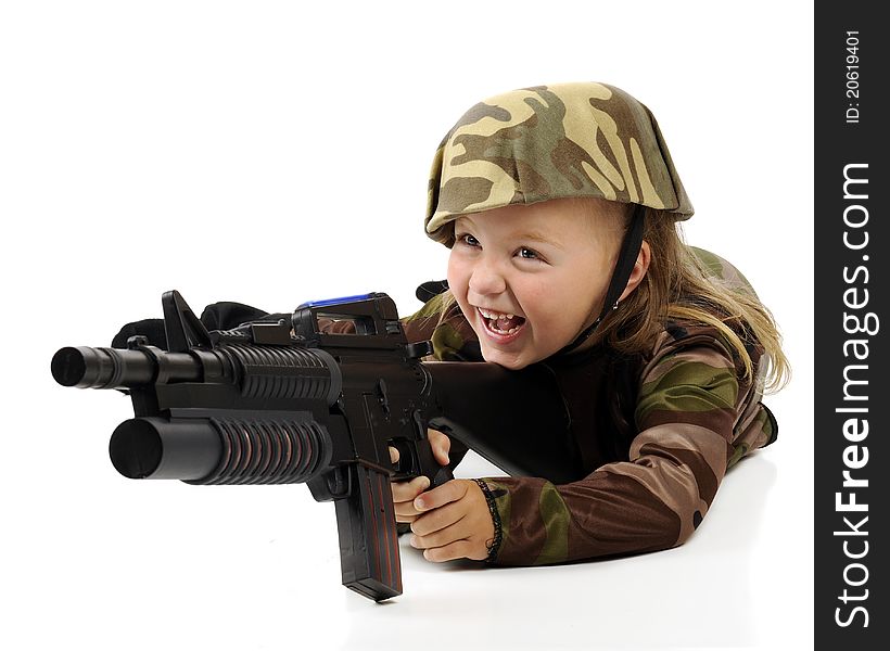 A pretty little girl having fun in a camouflage soldier's outfit while shooting a toy machine gun. Isolated. A pretty little girl having fun in a camouflage soldier's outfit while shooting a toy machine gun. Isolated.