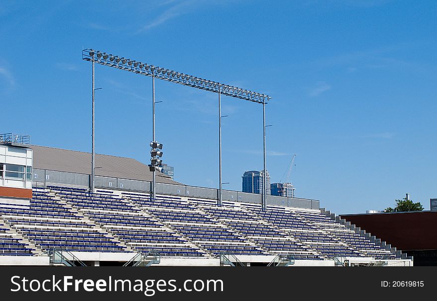 Stadium seating in daytime under blue sky. Stadium seating in daytime under blue sky