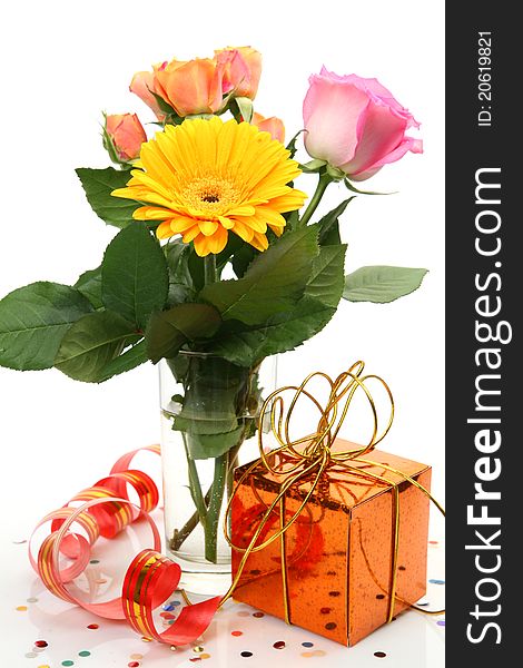 Fine flowers and gift on a white background