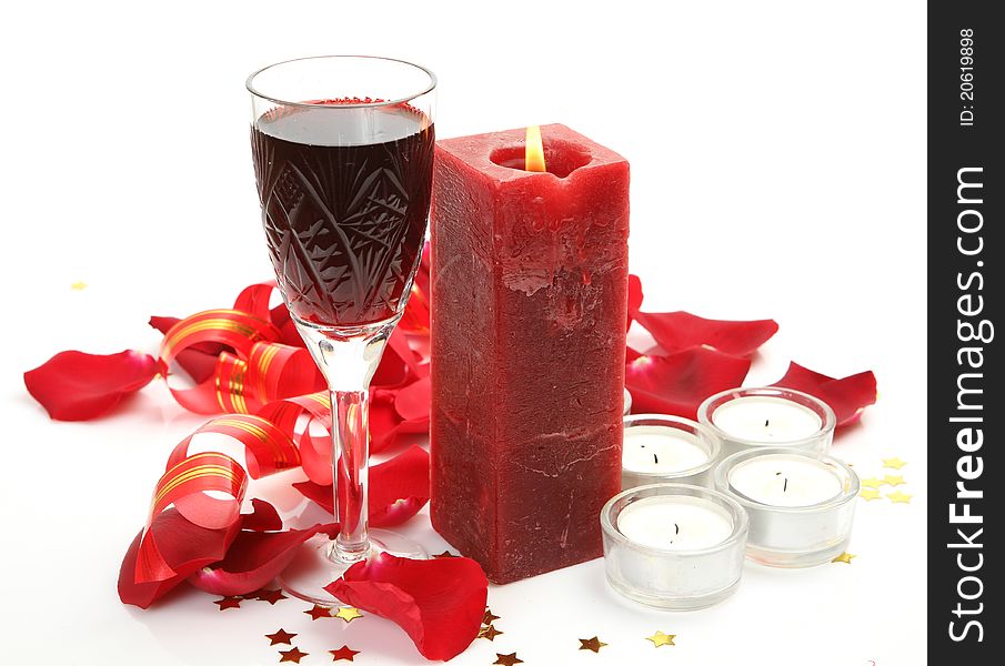 Wine and candles on a white background