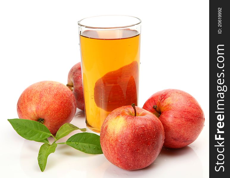 Ripe fruit and juice on a white background