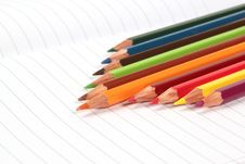 Pencil Crayons On White Writing Paper Royalty Free Stock Photos