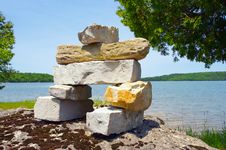 Inukshuk Over Looking A Lake. Stock Images Inukshuk Over Looking A Lake. Stock Images