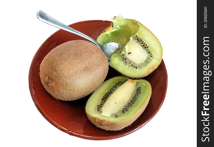 Fresh kiwi on ceramic plate in isolated over white background