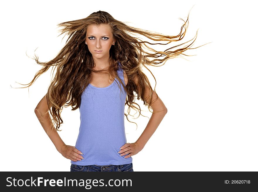 Fashion model posing in the wind. Isolated over white