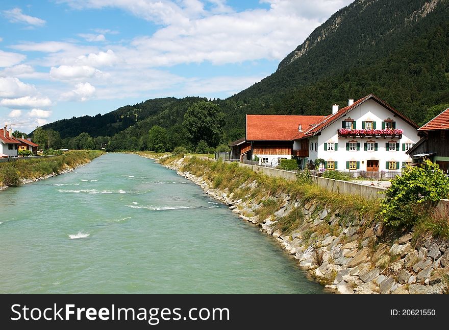 Blue river and blue sky in small town next to Alps. Blue river and blue sky in small town next to Alps