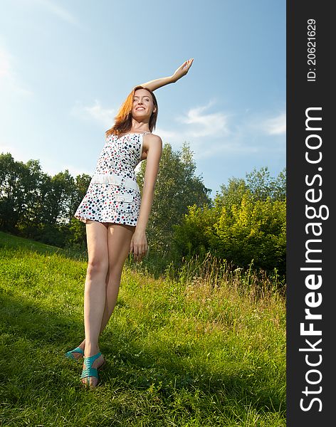 Portrait of a beautiful young woman smiling against the sky - Outdoor. Portrait of a beautiful young woman smiling against the sky - Outdoor