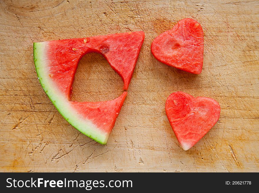 Watermelon hearts cut out fro a slice of watermelon