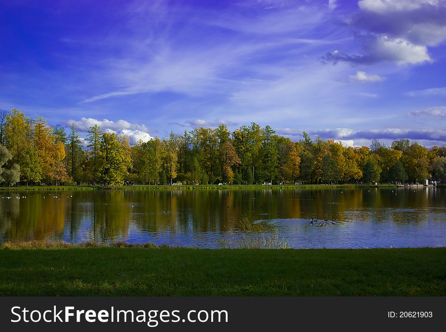 Reflection of colorful trees in water during autumn time. Reflection of colorful trees in water during autumn time