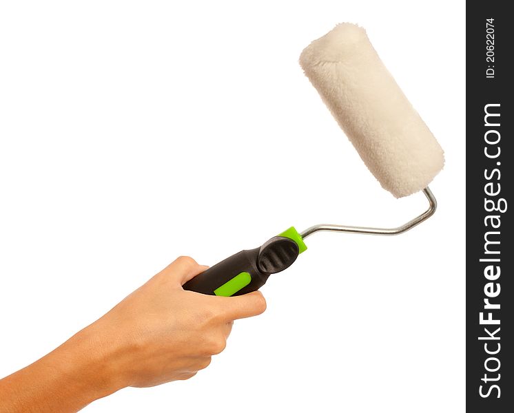 A female hand holding a paint roller on an isolated white background. A female hand holding a paint roller on an isolated white background