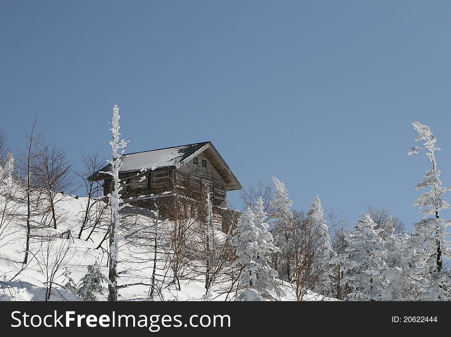 Wooden snow hut in snow mountain