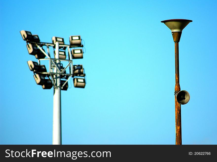 Old amplifier with modern stadium light on the background. Old amplifier with modern stadium light on the background